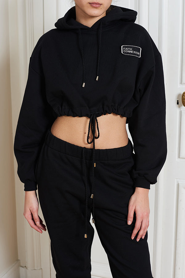 CROPPED LOGO HOODIE IN BLACK - Faith Connexion