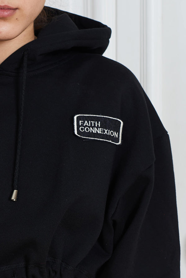 CROPPED LOGO HOODIE IN BLACK - Faith Connexion