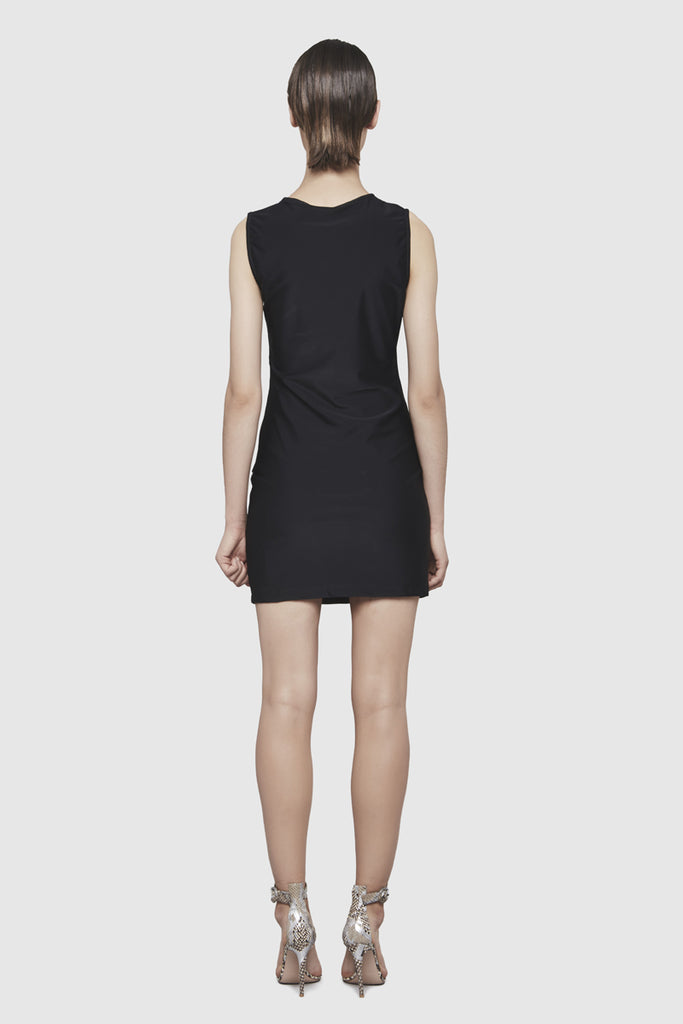 A woman is wearing a Shuko black sleeveless dress by Faith Connexion, a brand of luxury clothes
