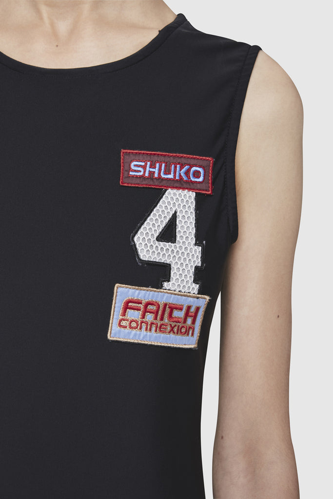 A close-up of a Shuko black sleeveless dress by Faith Connexion, a brand of luxury clothes